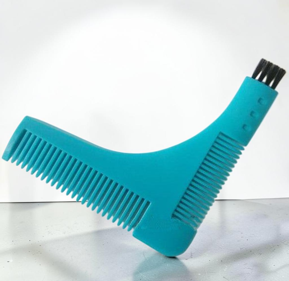 TheGromify precision beard lining tool in teal with a built-in cleaning brush for symmetrical grooming